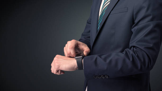istock Man in suit wearing smartwatch. 1061267628