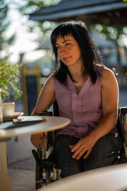 istock Disability women in cafe bar 1061275142