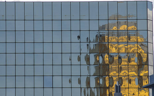 istock Glass mirror windows with reflections of buildings 1061275374
