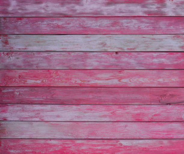 istock pink grungy old scratched wooden wall 1061275664