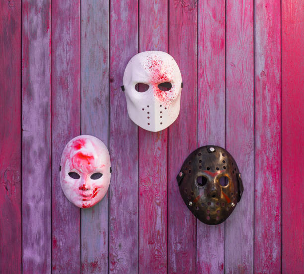istock bloody masks on red background 1061280254