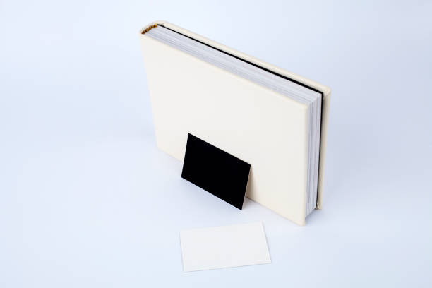 istock Blank business cards leaning on the book 1061281844