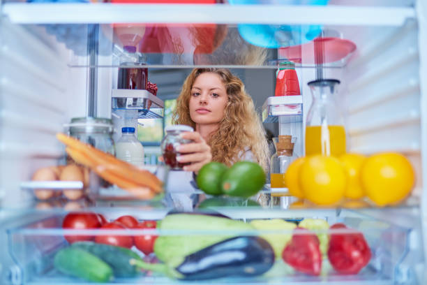 istock Woman taking food from fridge. 1061283242
