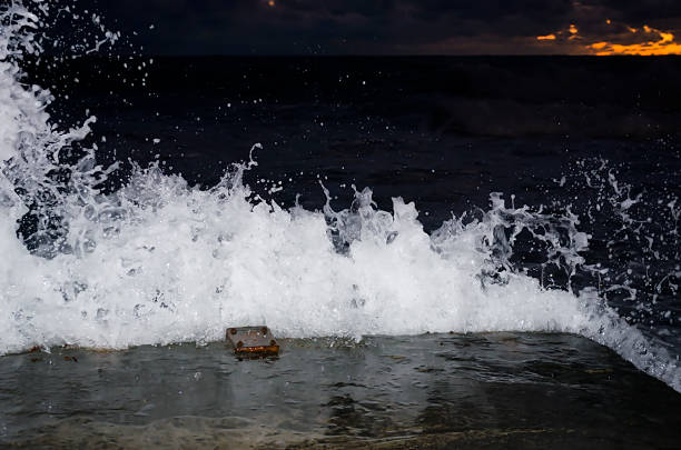 Splashing wave on the Black sea in the night.