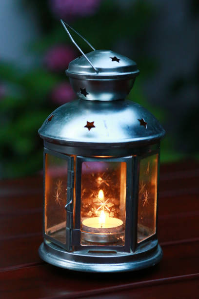 istock Classical retro  lantern with candle  Vintage style glowing lamp as a background 1061285586