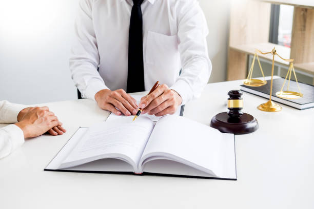 istock Lawyers Doing Paperwork In Courthouse 1061288454