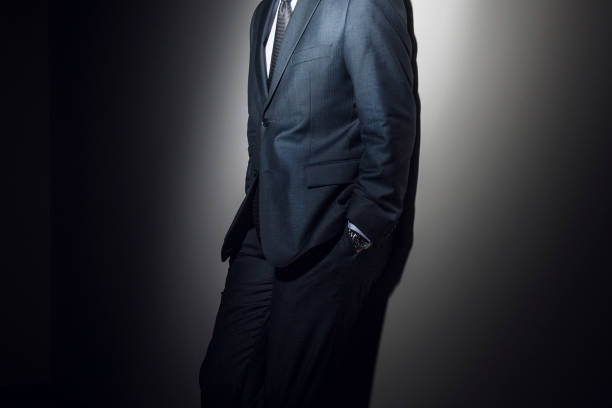 istock Midsection Of Businessman Leaning On Wall 1061288592