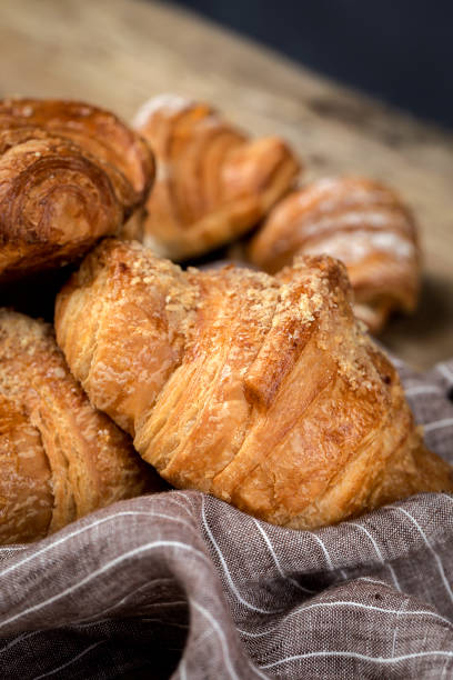 istock freshly baked buns with almonds. Croissants and brioches 1061296224