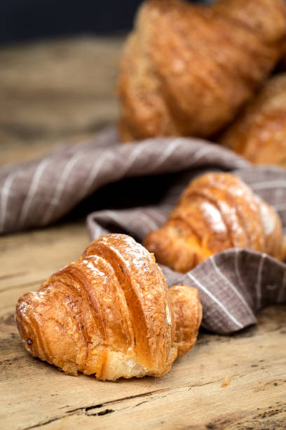 istock freshly baked buns with almonds. Croissants and brioches 1061296280