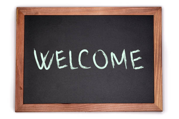 istock WELCOME sign written on chalk board. Blackboard with wooden frame. 1061300308