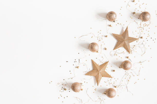istock Christmas composition. Christmas golden decorations on white background. Flat lay, top view, copy space 1061300338