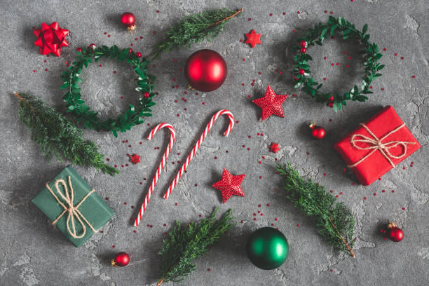 istock Christmas composition. Gifts, fir tree branches, red decorations on black background. Christmas, winter, new year concept. Flat lay, top view 1061302348