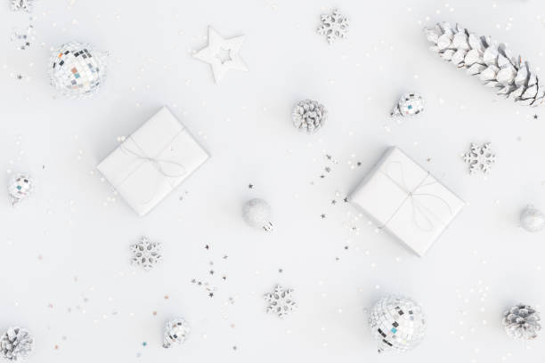 istock Christmas composition. Christmas gifts, silver decorations on pastel gray background. Flat lay, top view, copy space 1061302856