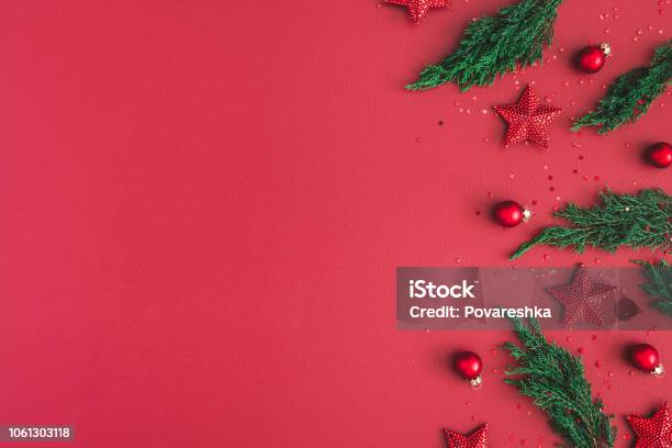 Christmas Composition Christmas Red Decorations Fir Tree Branches On Red Background Flat Lay Top View Copy Space Stock Photo - Download Image Now