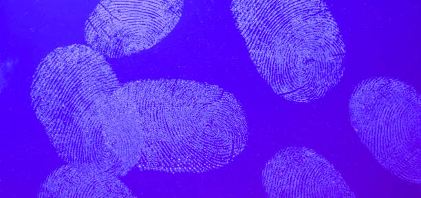 青い背景のガラスに指紋 - fingerprint security system technology forensic science ストックフォトと画像