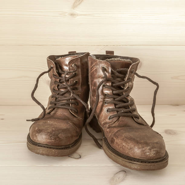 istock A pair of old worn well used brown leather boots. 1061315458