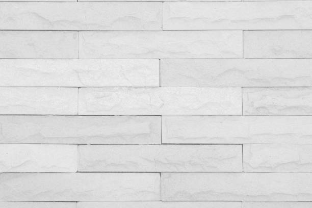 istock Seamless Grey pattern of decorative brick sandstone wall surface with concrete of modern style design decorative uneven have cracked realmasonry wall of multicolored stones or blocks with cement. 1061315530