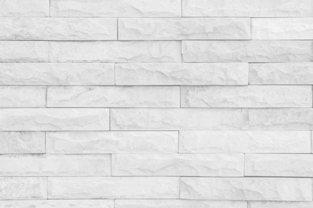 istock Seamless Grey pattern of decorative brick sandstone wall surface with concrete of modern style design decorative uneven have cracked realmasonry wall of multicolored stones or blocks with cement. 1061315532