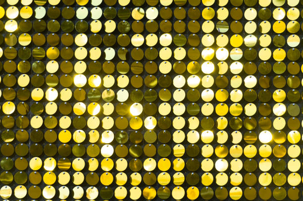 istock Background sequin. sequin BACKGROUND. glitter surfactant. Holiday abstract glitter background with blinking lights. Fabric sequins in bright colors. Fashion fabric glitter, sequins 1061318298