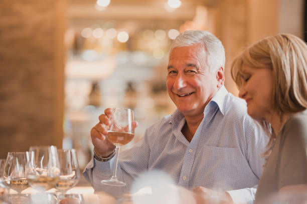 istock Mature Man Enjoying Meal in Restaurant 1061318704