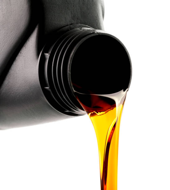 istock pouring car engine oil from bottle isolated on white background 1061319290