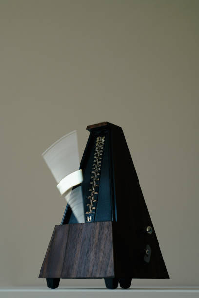 istock vintage metronome, on a gray background. 1061322256