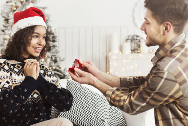 istock Romantic proposal on Christmas eve 1061322592