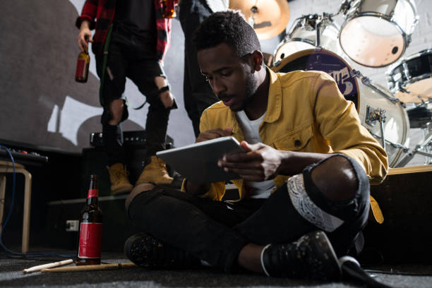 istock Young African-American Man with Gadget 1061326188