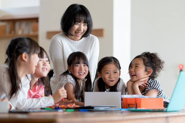 istock Young group of students in a robotics club having fun 1061332260