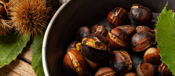 istock Roasted chestnuts in iron skillet 1061332492