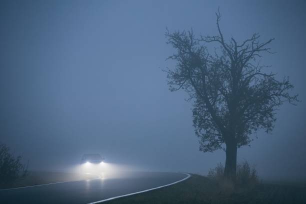 istock Car in thick fog 1061333416