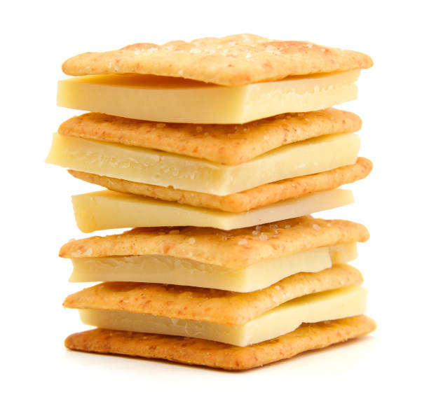 Delicious crackers with cheese on white background