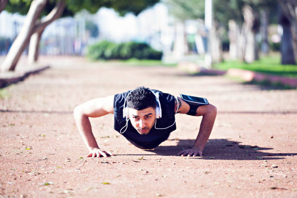 istock Young man exercising in park. 1061338390