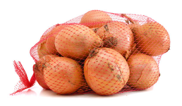 istock Onions isolated on white in a fishnet. 1061338716