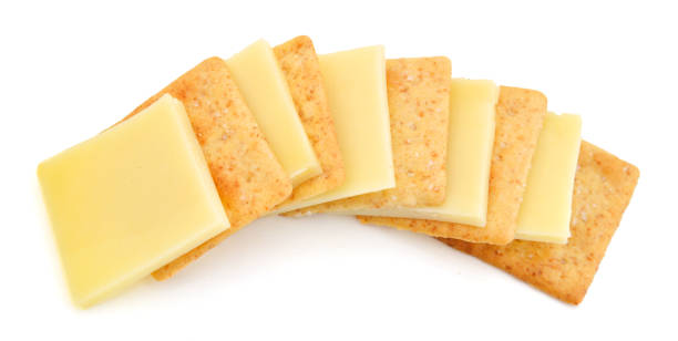 istock Delicious crackers with cheese on white background 1061338744