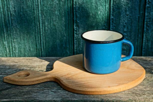 istock one big blue metal mug stands on a wooden table 1061342694