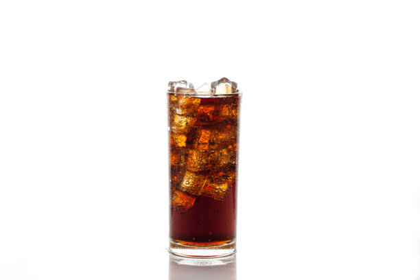 istock Cola in glass with ice isolated on white background 1061343618