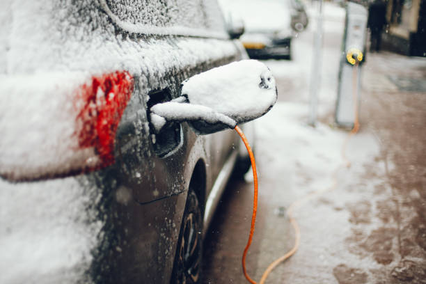 istock Charging an electric car with the power cable supply 1061345370