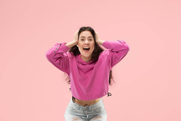 istock Winning success woman happy ecstatic celebrating being a winner. Dynamic energetic image of female model 1061346104