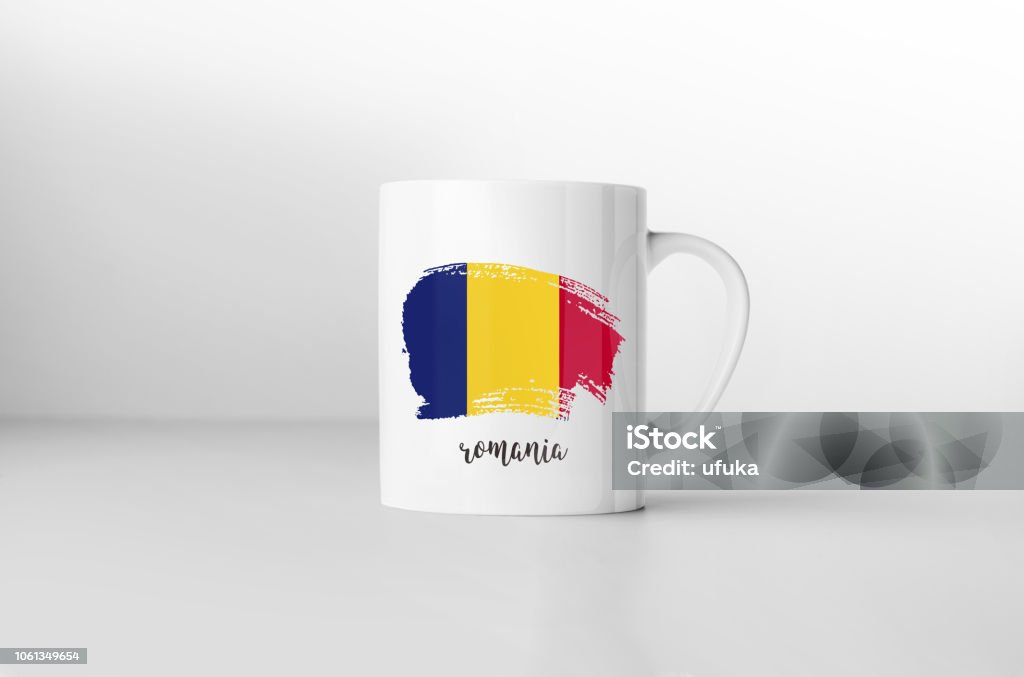 Romania flag souvenir mug on white background. 3D rendering. Bucharest Stock Photo