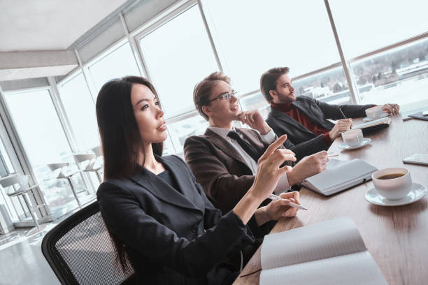 istock Businesspeople at office working together having video call 1061351966