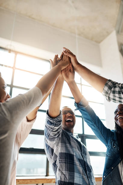 success, we're coming for you! - team human hand cheerful close up imagens e fotografias de stock