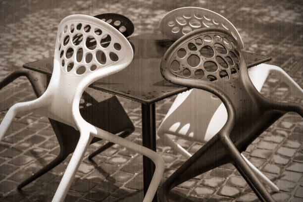 istock chairs in a street cafe 1061354806