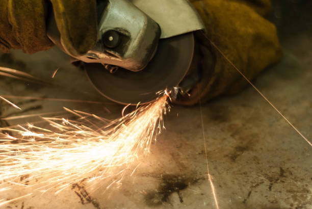 istock metal work with a hand-held circular saw 1061354926
