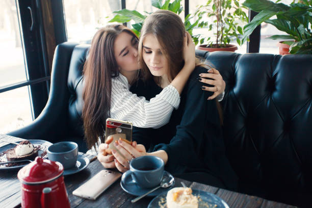 istock Two young women taking selfie with smart phone 1061357050