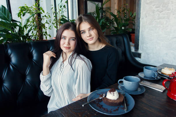 istock Two young women taking selfie with smart phone 1061357162