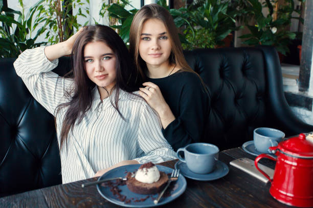 istock Two young women taking selfie with smart phone 1061357220