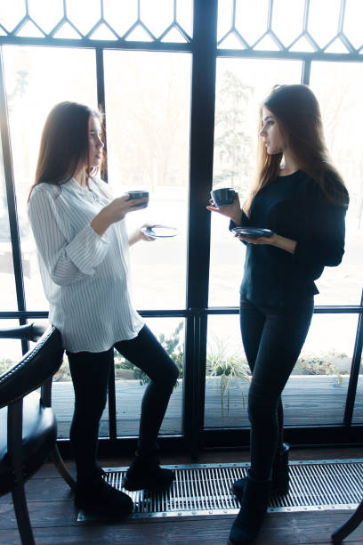istock Two young women taking selfie with smart phone 1061357266