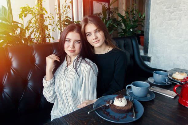istock Two young women taking selfie with smart phone 1061357520