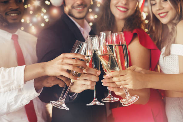 istock Champagne glasses in people hands at New Year 1061358116